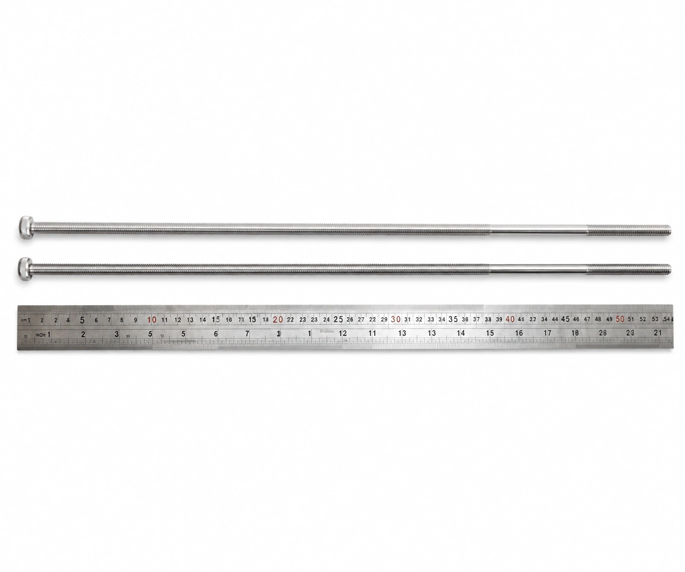 Representative extra-long machine screws beside a ruler