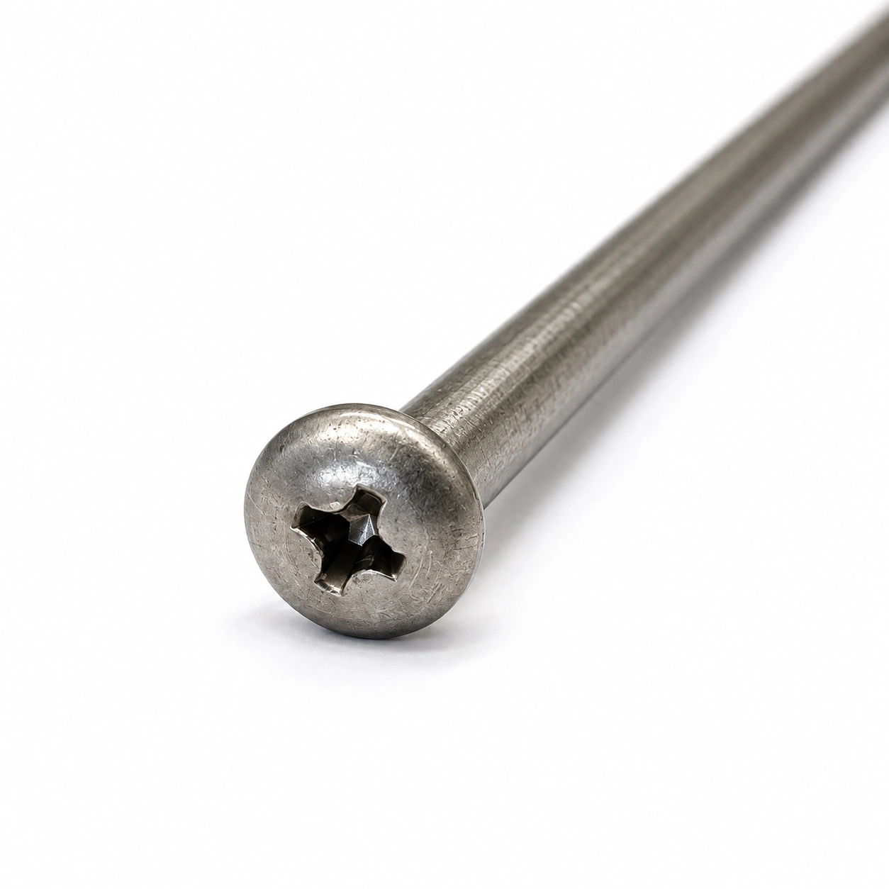 Close up of a long Phillips pan head machine screw